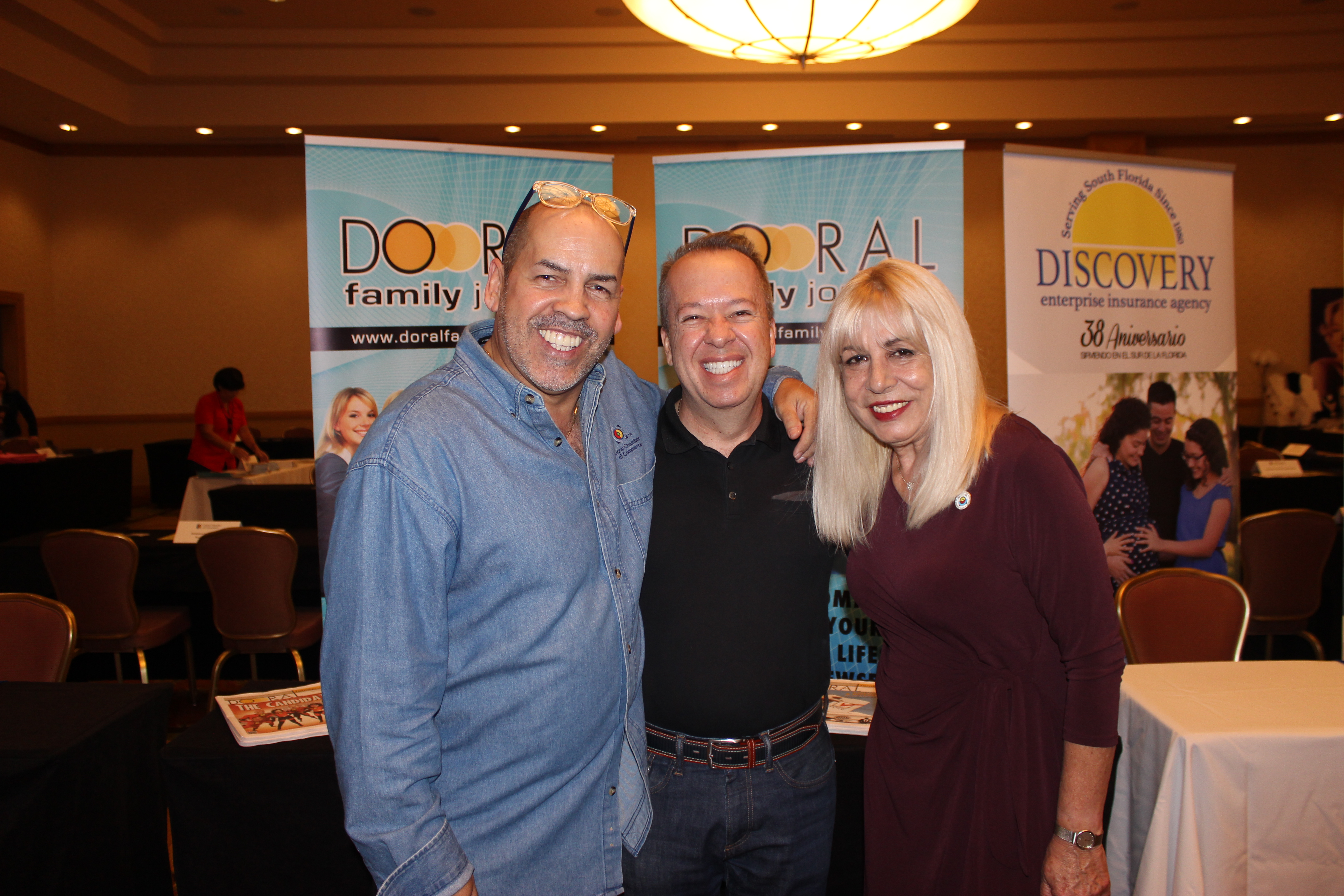 Manny Sarmiento, Carmen Lopez, with a member in ExpoMiami 2018 hosted by the Doral Chamber of Commerce.