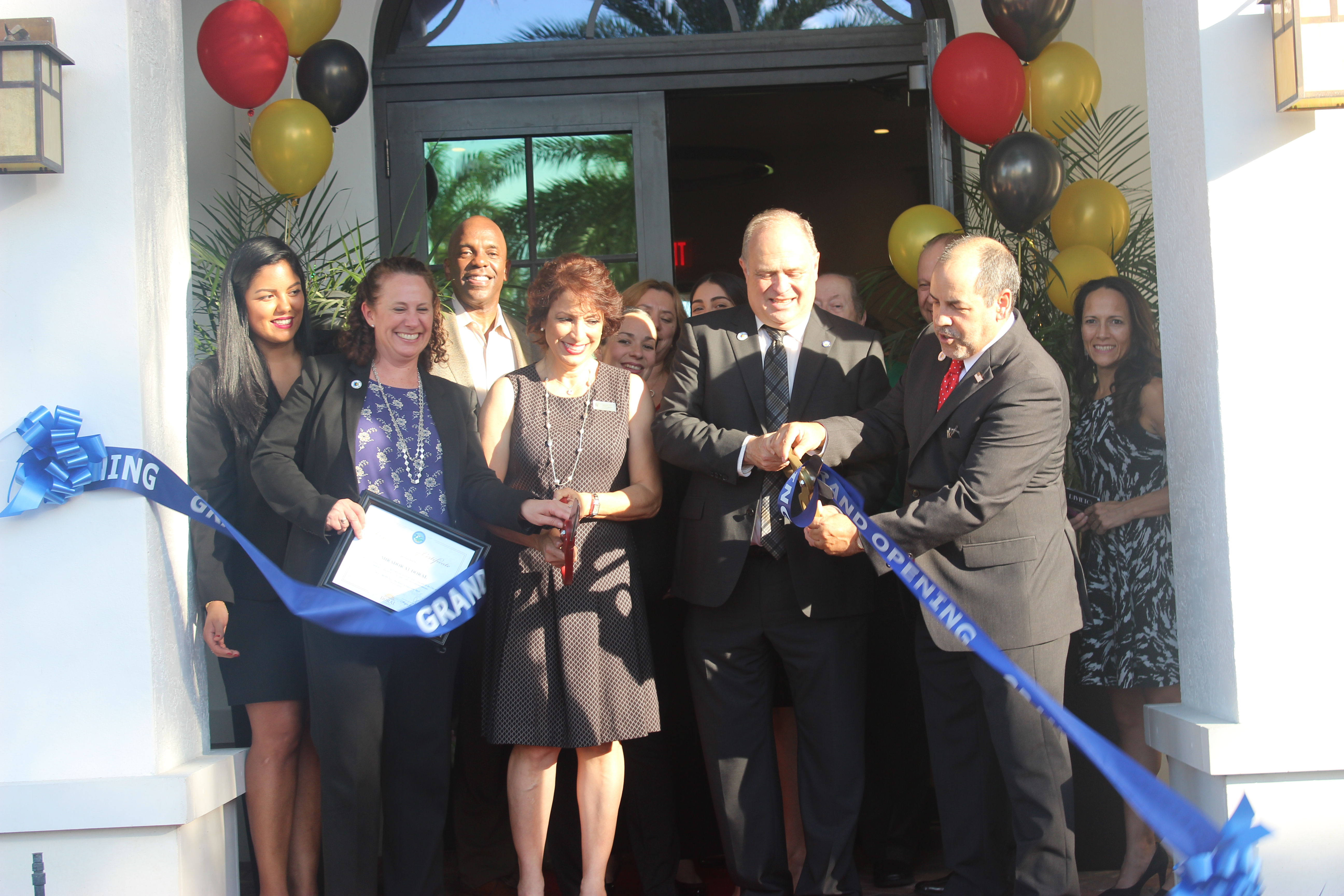Ribbon cutting at Mirador Apartments Grand Opening hosted by the Doral Chamber of Commerce.