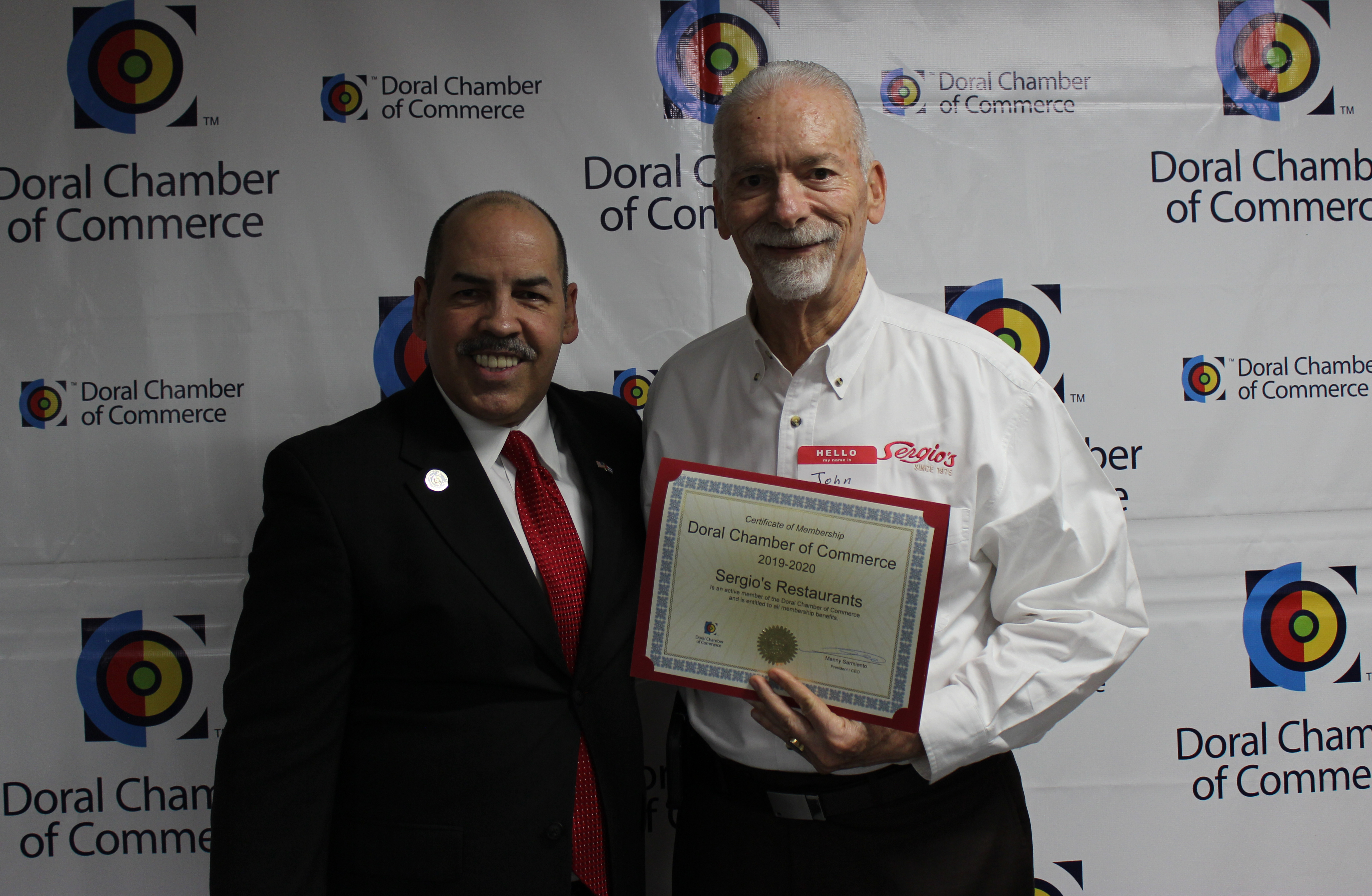 Doral Chamber of Commerce introduces Circle of Success event, Sergios owner being given an award by Manny Sarmiento.