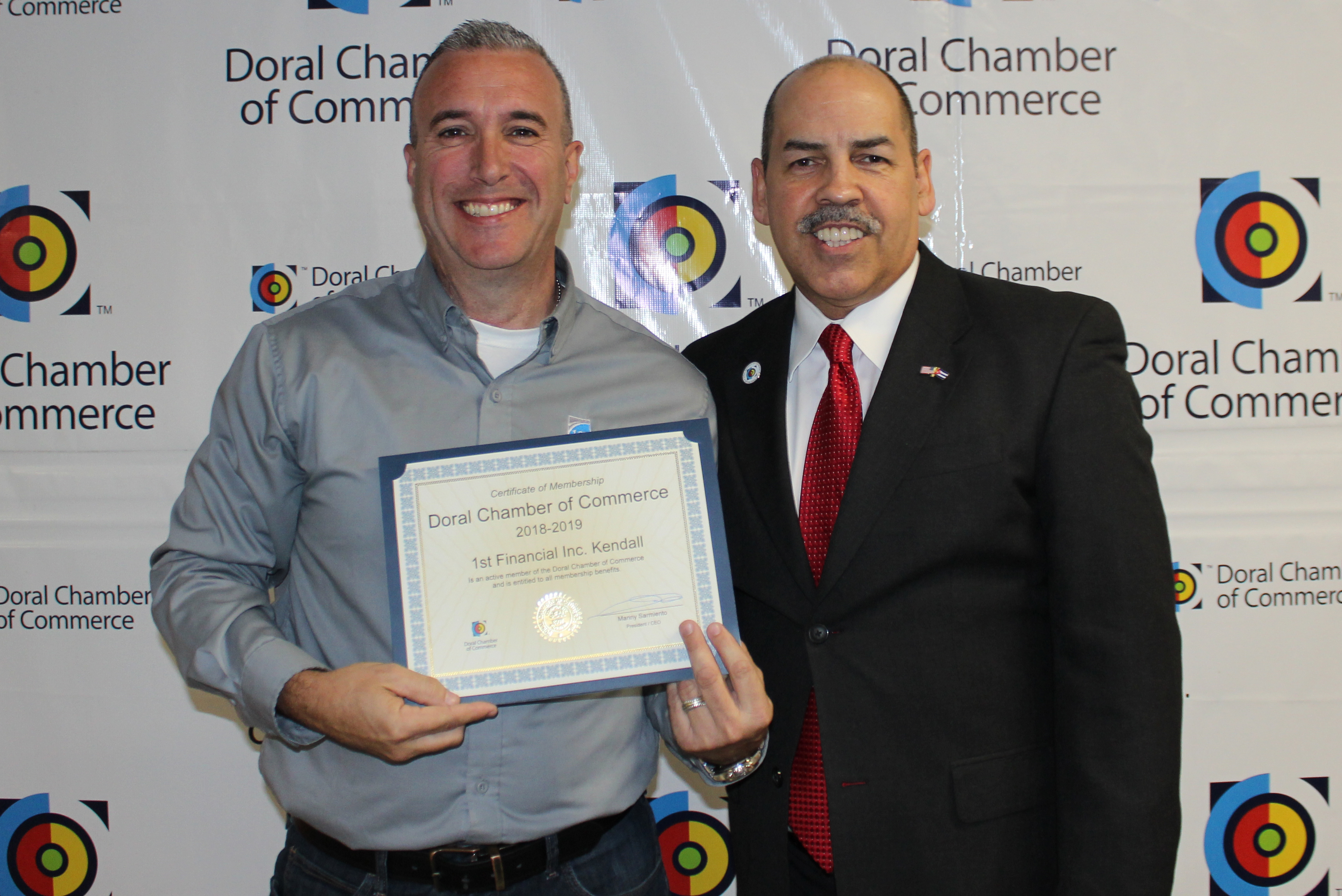 Doral Chamber of Commerce introduces Circle of Success event, member from 1st Financial being awarded by Manny Sarmiento.