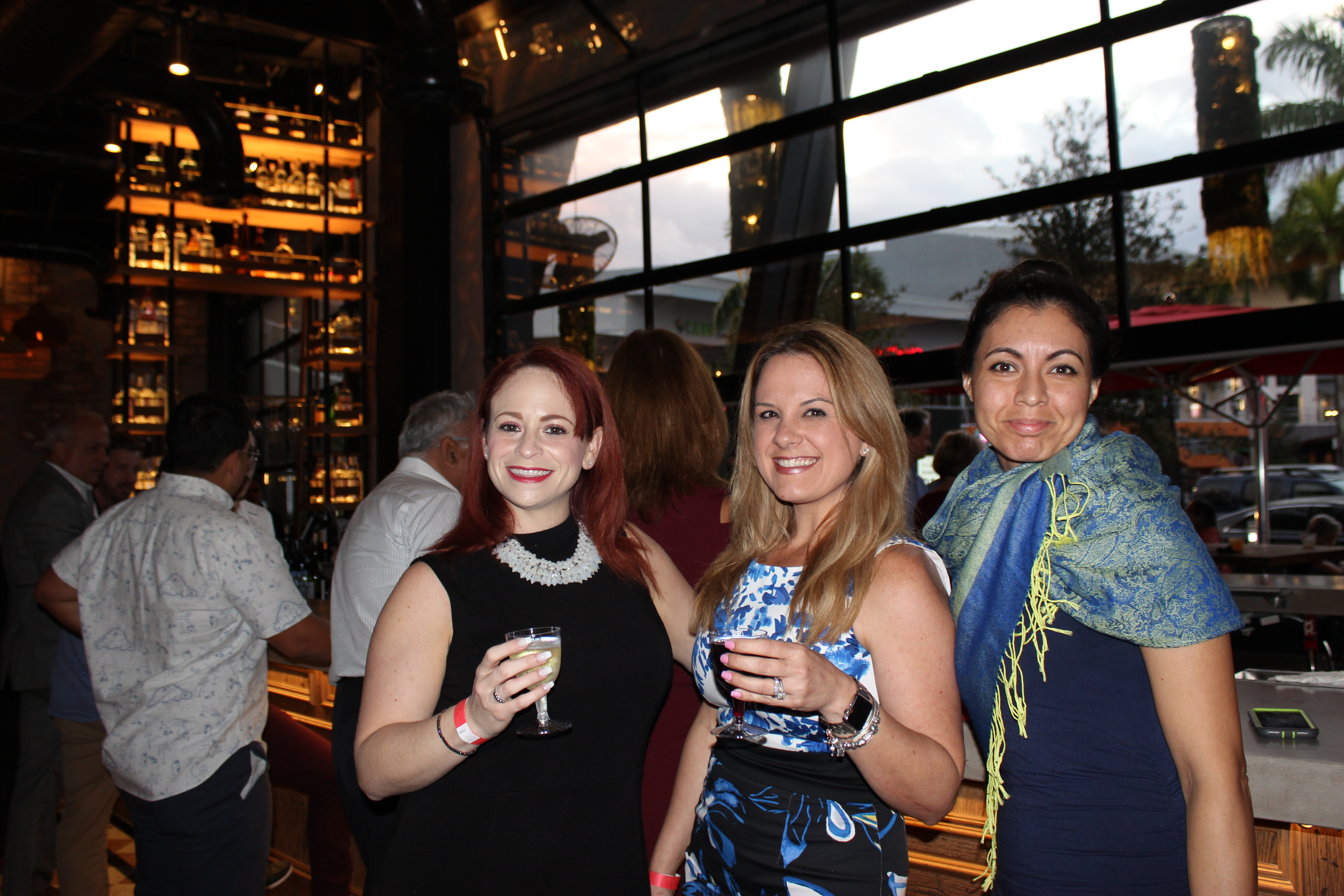 Doral Chamber of Commerce introduces Novecento Grand Opening, ladies taking a group photo.