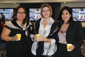 Doral Chamber of Commerce introduces DCC 21st Century Technology event, ladies taking a group photo together.