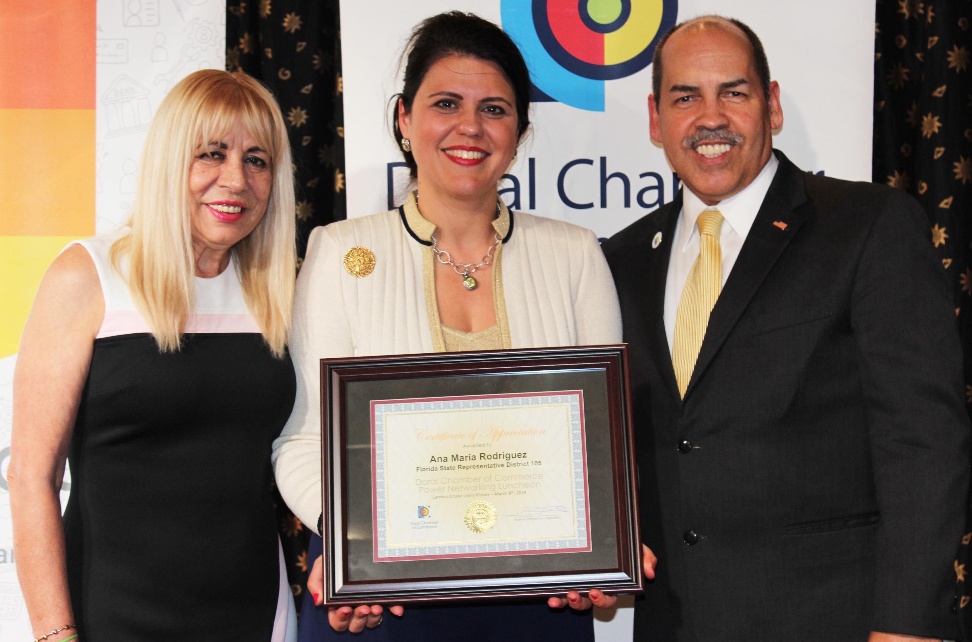 Doral Chamber of Commerce Carnival Cruise Luncheon 2019, Networking Event in Miami, Florida. Manny Sarmiento and Carmen Lopez taking a picture with State Representative Ana Maria Rodriguez.
