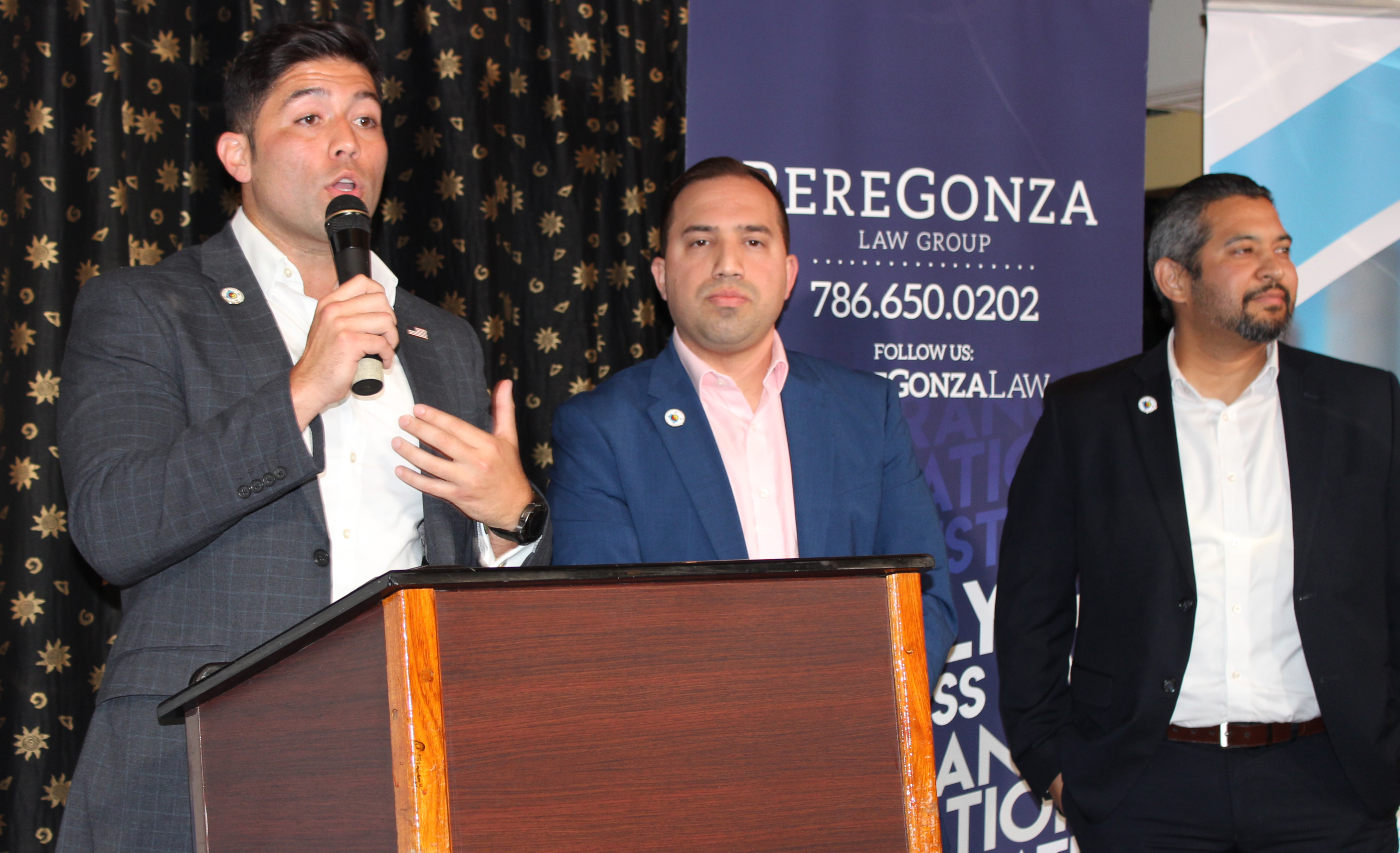 Doral Chamber of Commerce Carnival Cruise Luncheon 2019, Networking Event in Miami, Florida. PereGonza Law Group talking on stage, Robert Gonzalez.