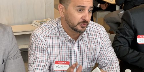 Doral Chamber of Commerce IKEA Speed Networking Event, member talking about his business before he passes his business card, creating a relationship.