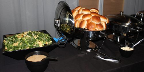 Doral Chamber of Commerce introduces bread and salad with dressing at Topgolf Doral Luncheon Networking Event.