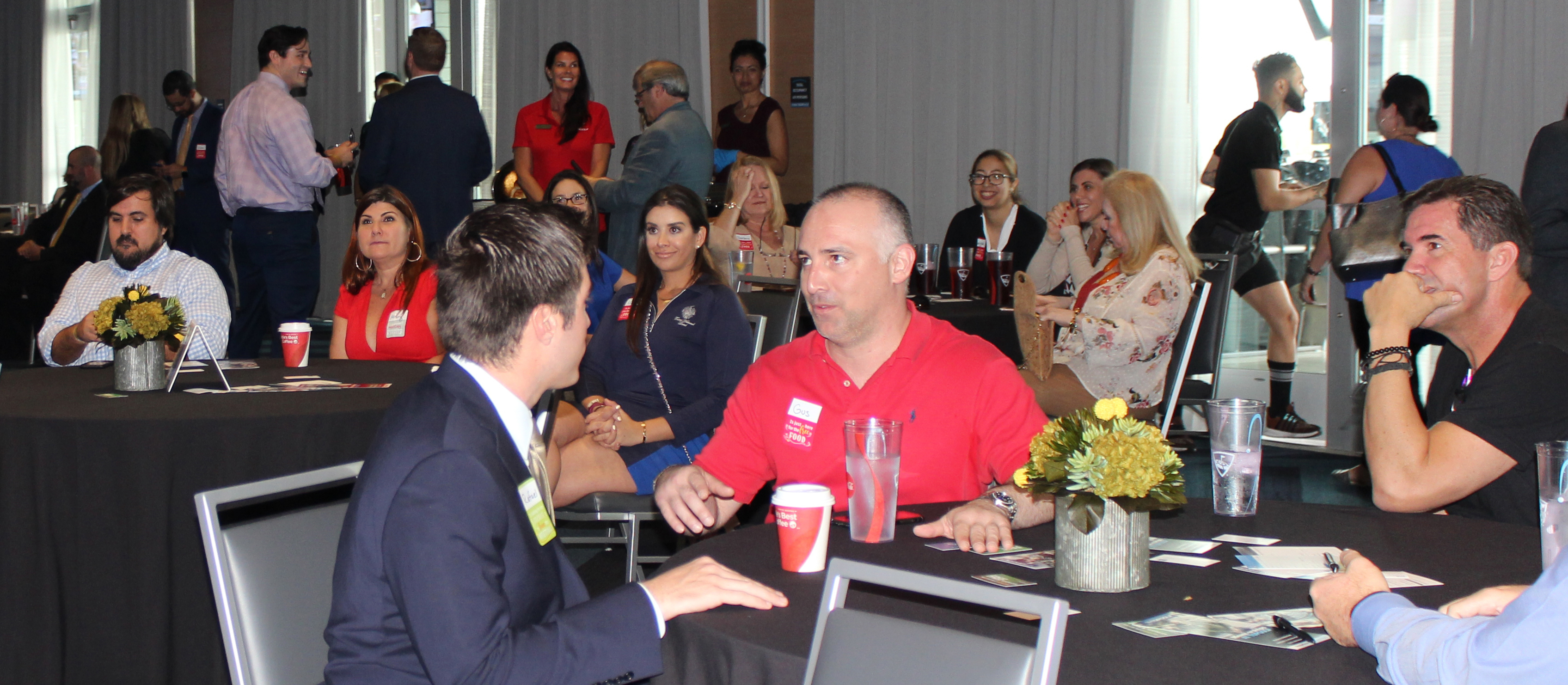 Doral Chamber of Commerce introduces members networking and talking at Topgolf Doral Networking Luncheon Event.