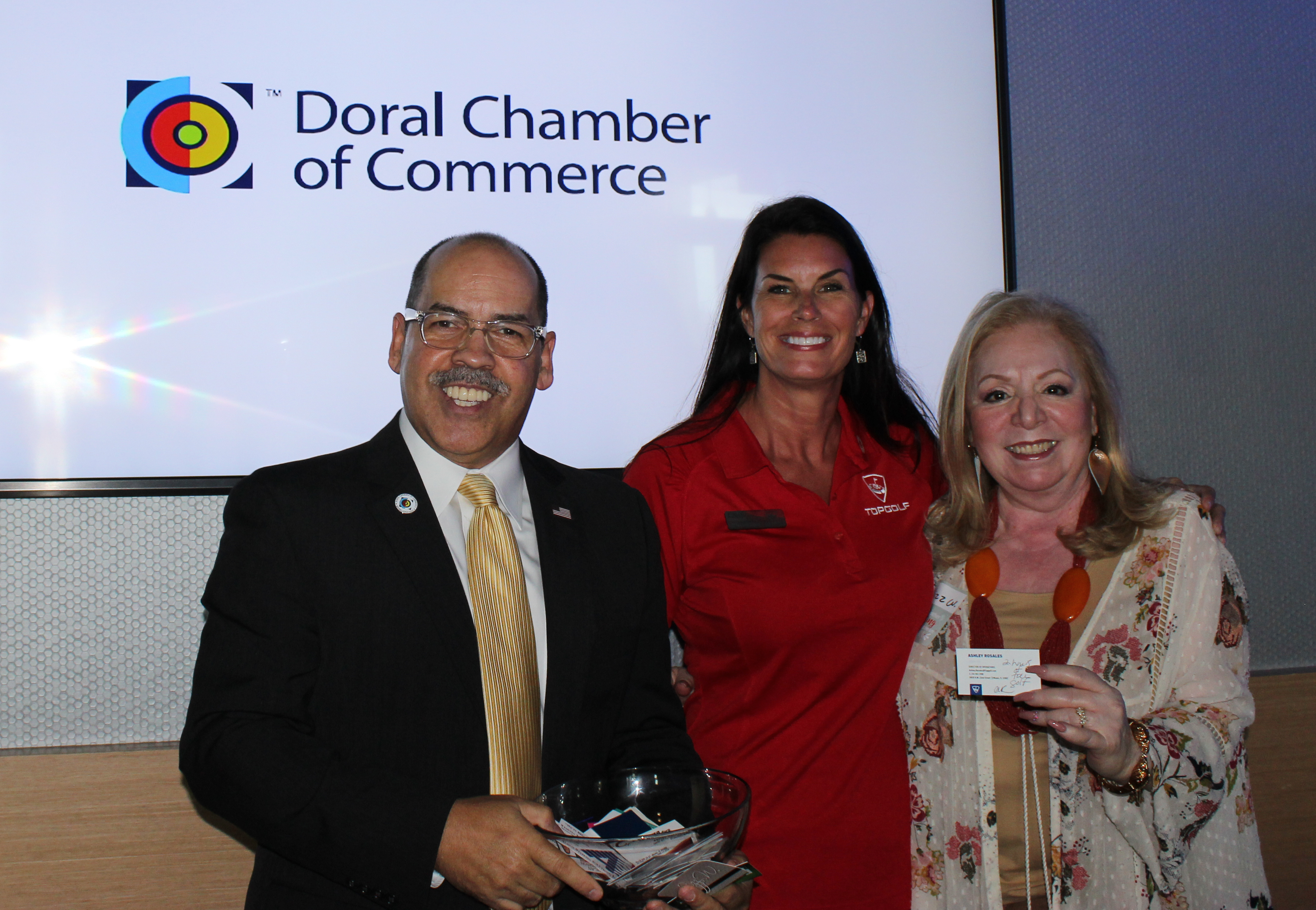 Doral Chamber of Commerce introduces Manny Sarmiento taking a group photo with Topgolf and The Miami Group at the Luncheon Networking Event.