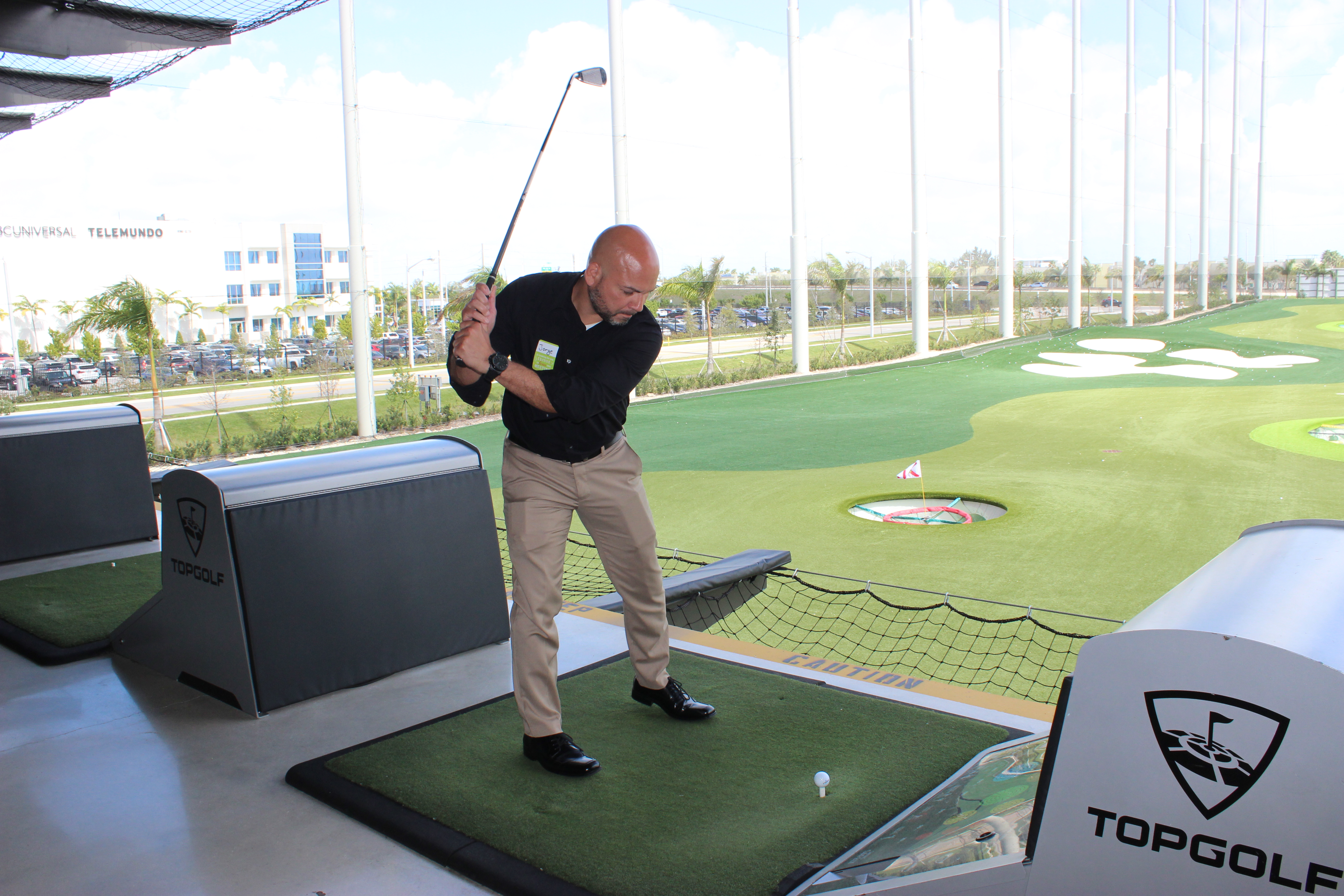 Doral Chamber of Commerce introduces a member playing golf, enjoying himself, and networking at Topgolf Doral Luncheon.
